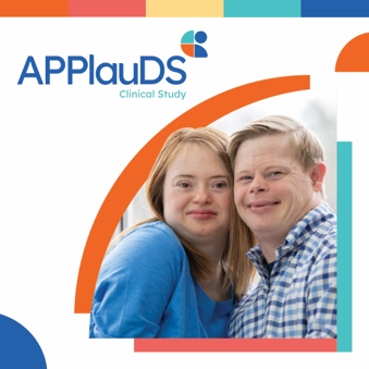 A young woman and a man, both with Down syndrome, smiling together, with the APPlauDS Clinical Study logo above them